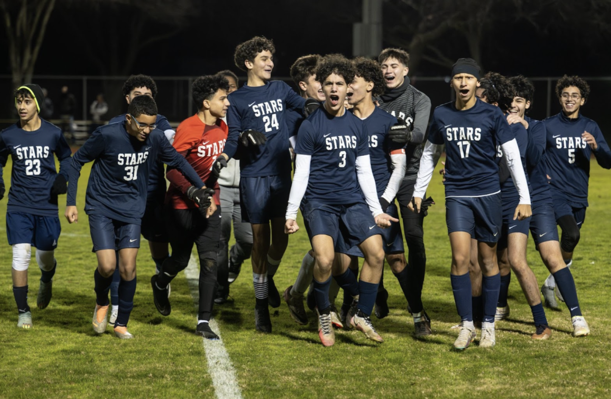 The BHA varsity soccer team celebrates their win at a home game.