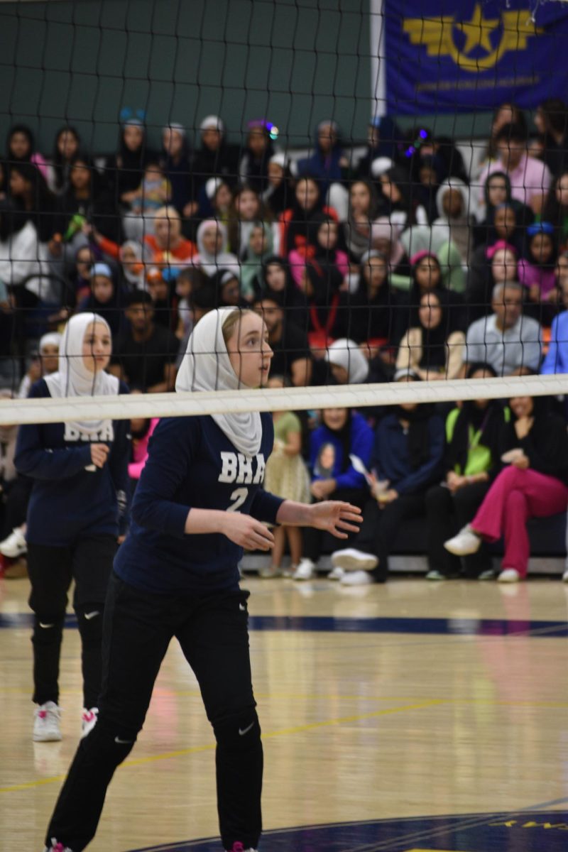 Senior Jena Sabagh prepares to receive the volleyball from the opposing team.