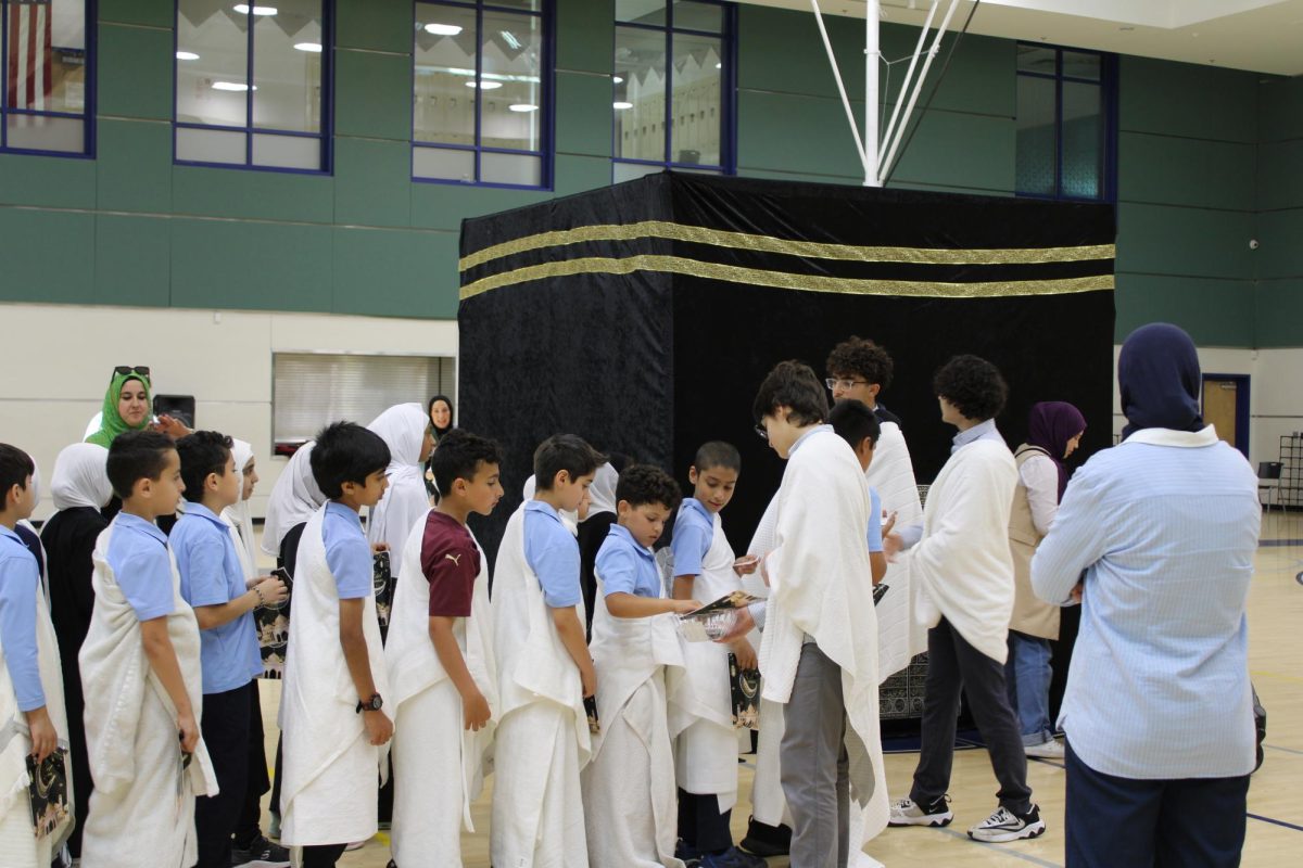 Elementary students prepare to make tawaf (circumambulation) around the Kaaba replica.