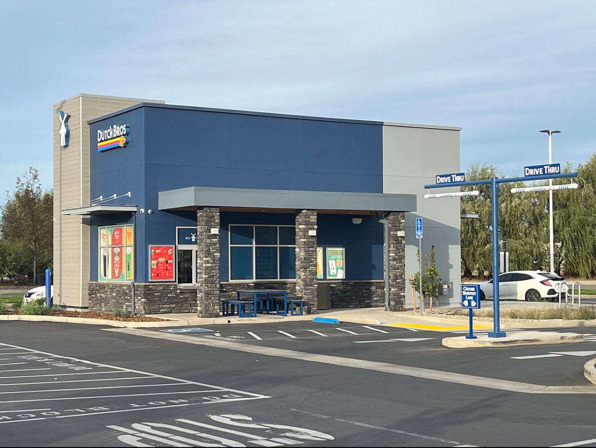 The exterior and drive through of a typical Dutch Bros cafe. 