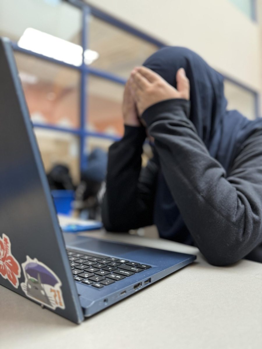 Amna Hassan working on her college applications.