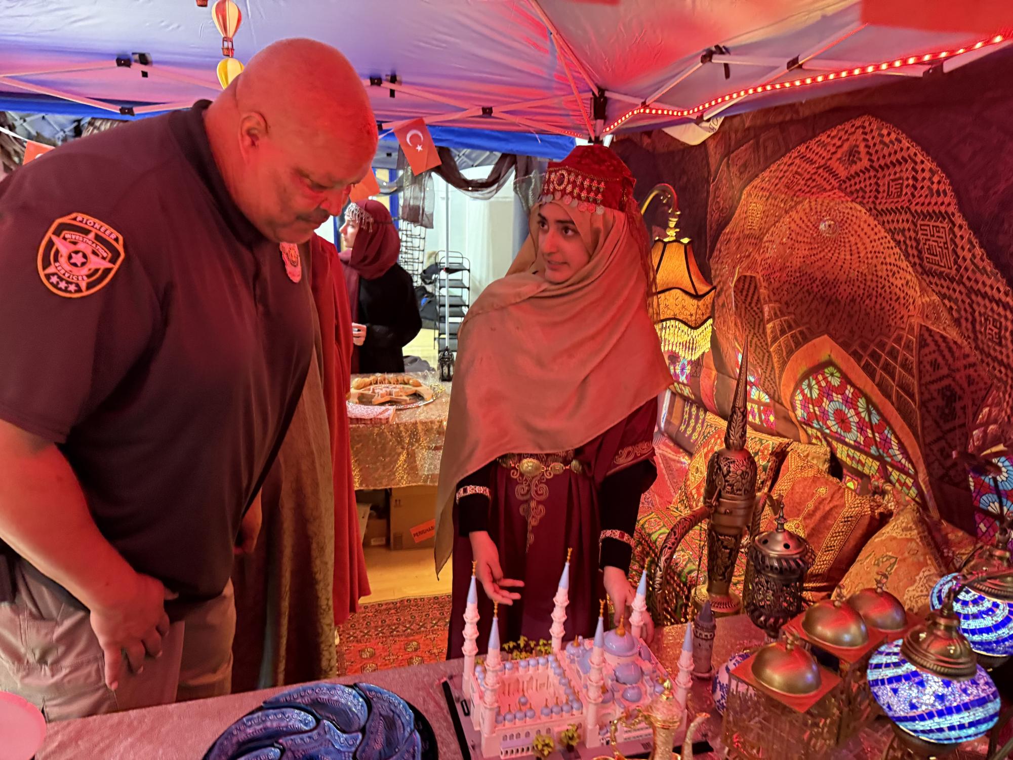 Freshman Merwa Muzaffar showcasing her Turkiye project to Brother Fred. (Photo by Merwa Muzaffar)