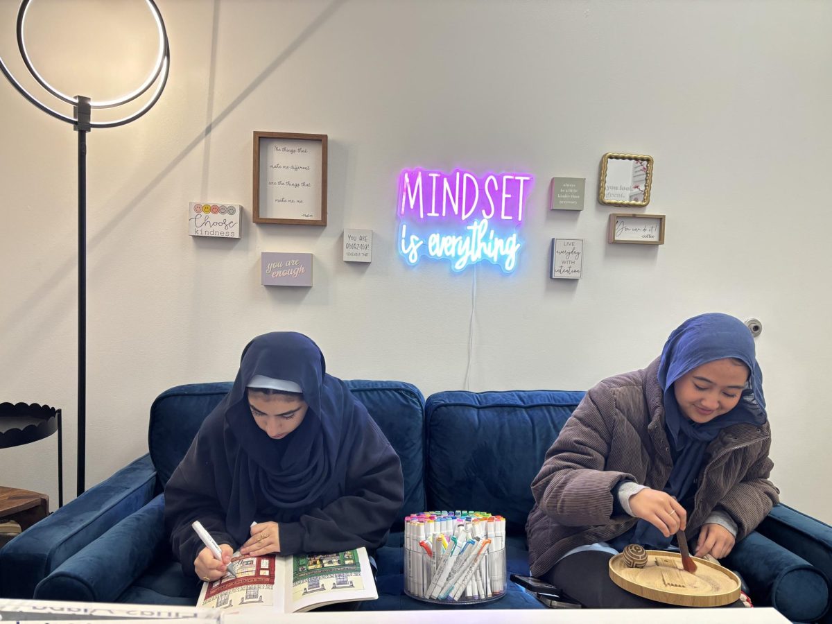 Juniors Leila Agel and Zia Zaidani using the Counseling Corner's activity materials to relax during the school day. 