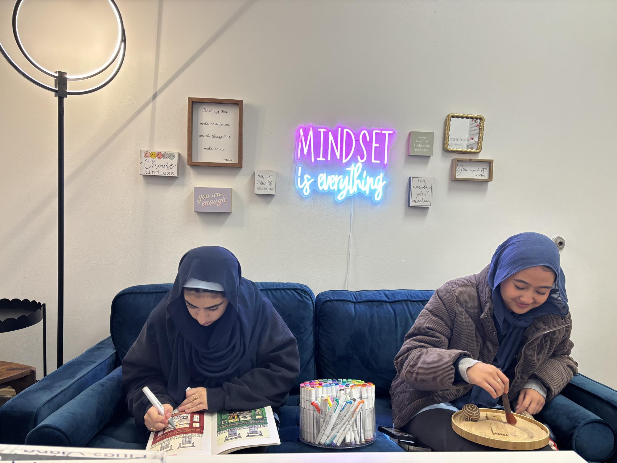 Juniors Leila Agel and Zia Zaidani using the Counseling Corner's activity materials to relax during the school day. 