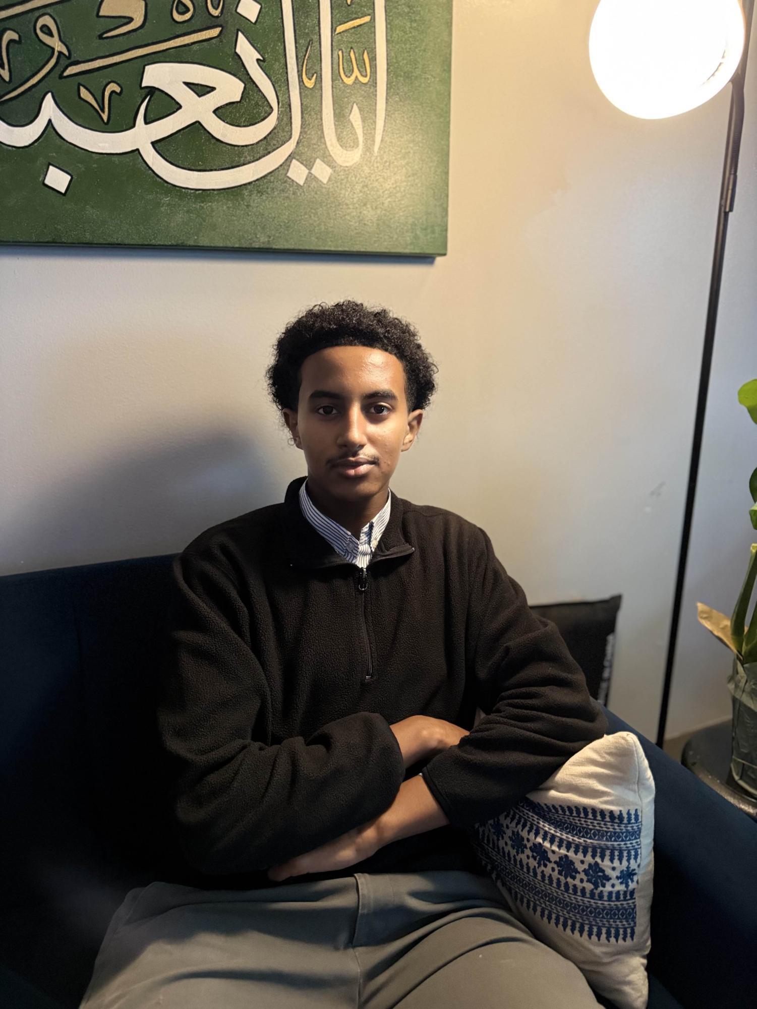 Junior Dinner Abdullah showing off his quarter zip