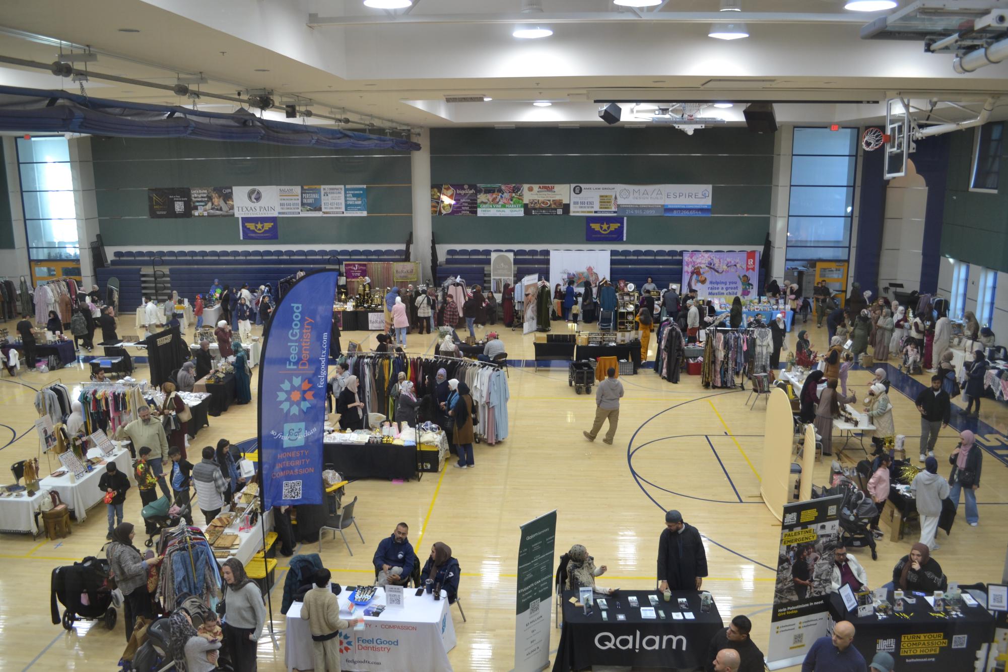 People walk around the gym, visiting stalls during the Ramadan Souq.