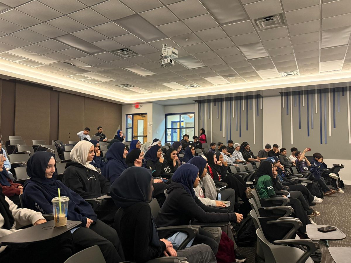 The BHA Auditorium packed with MIST members watching the boys improv group preform.