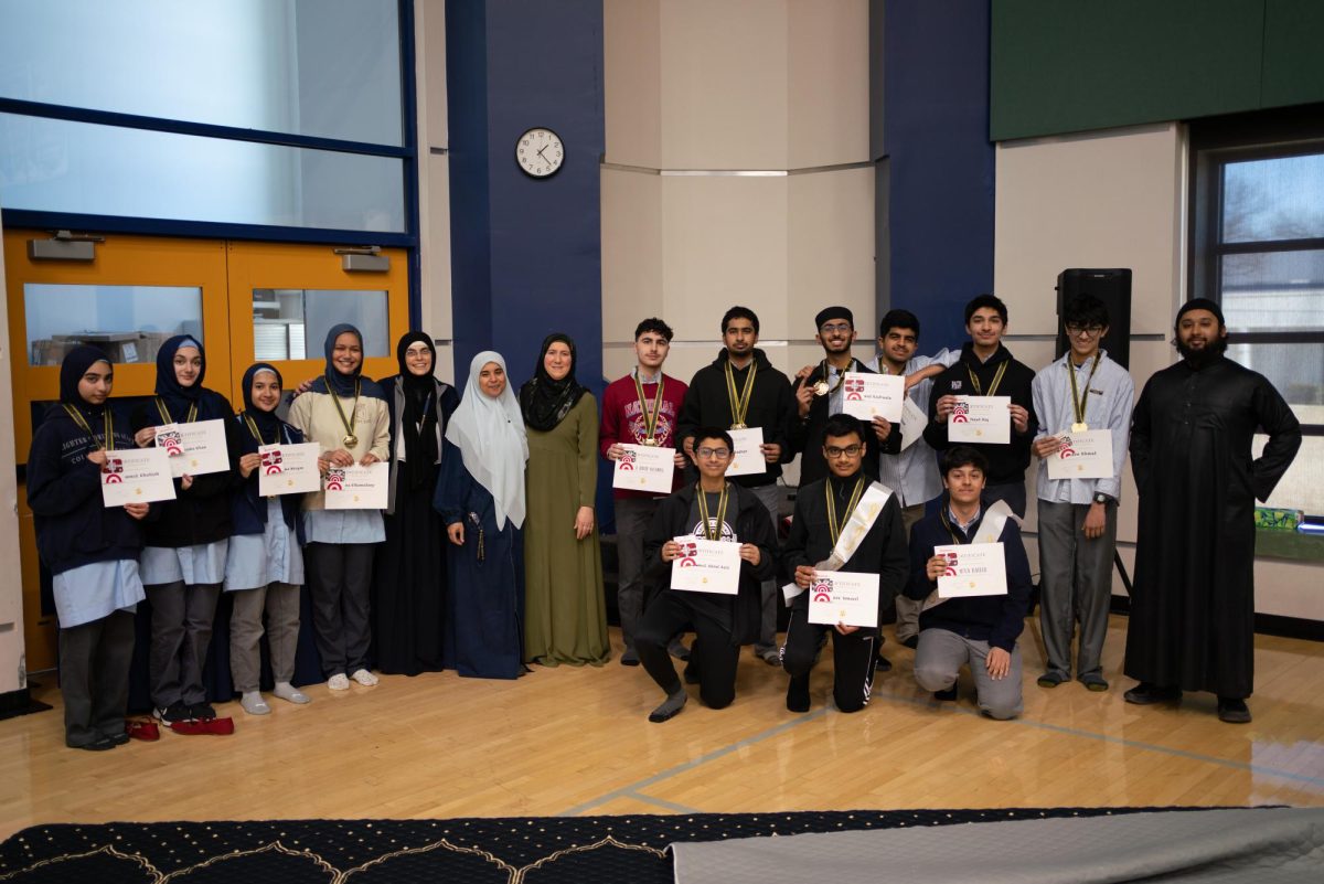 The winners of the Quran Competition with their medals and awards. (Photo by Ms. Sundus Khan)
